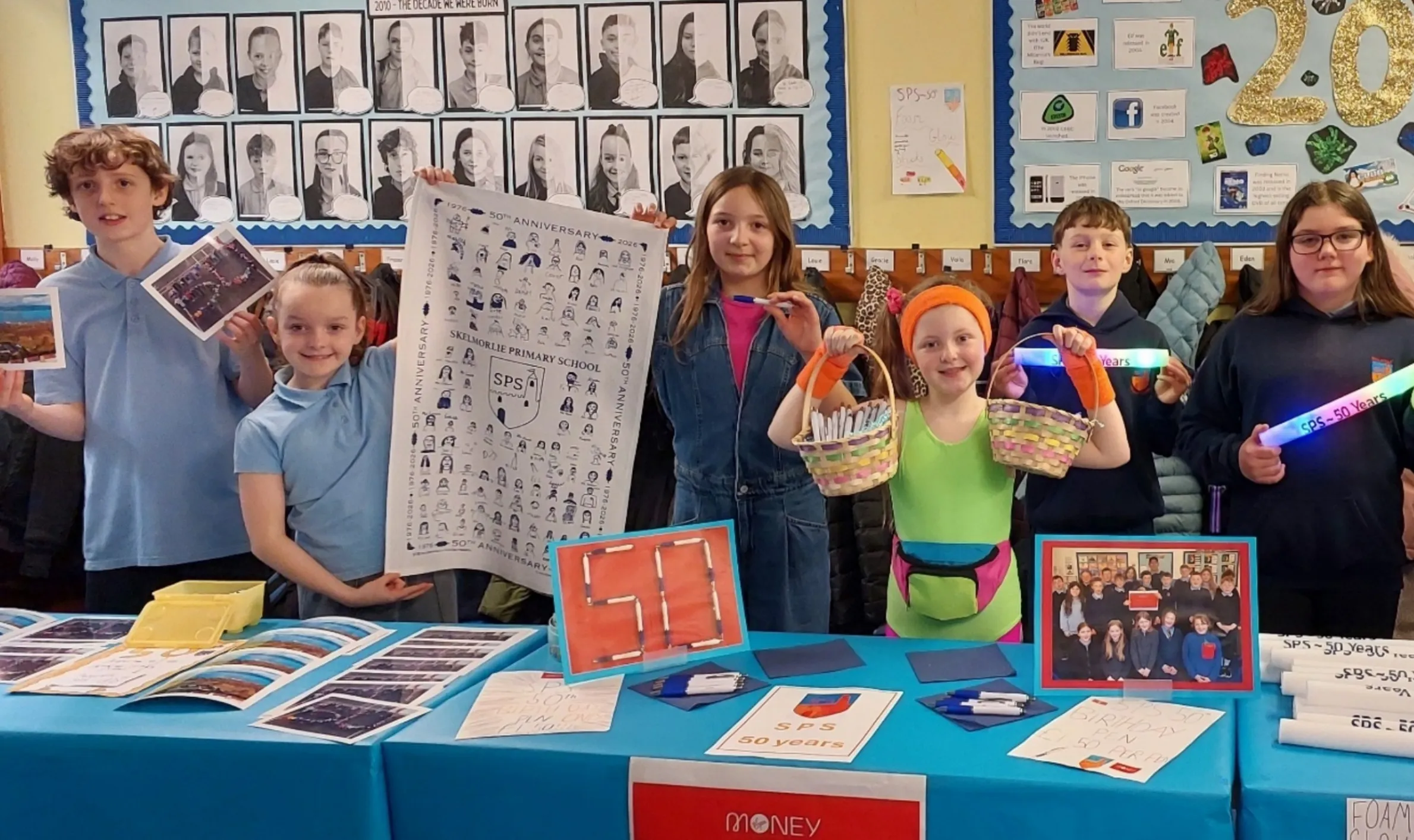 Pupils at Skelmorlie Primary School behind a stall celebrating 50 years of the modern school building