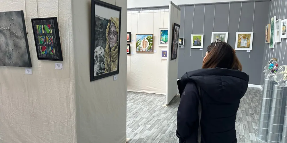 Person looking at art pieces