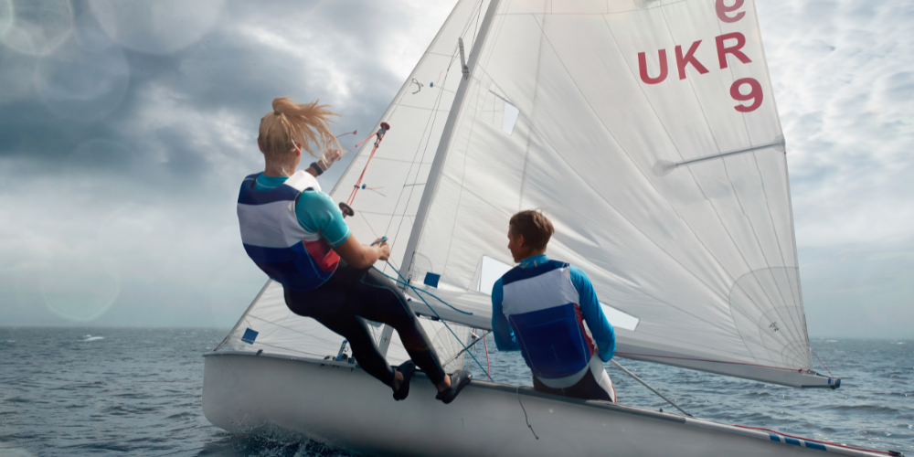 Two people sailing on small boat
