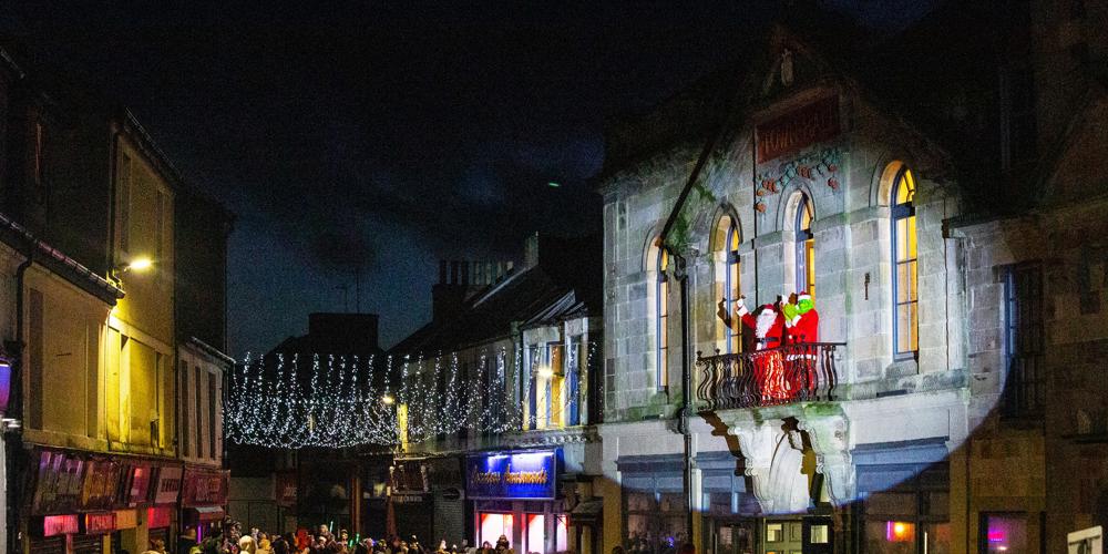 Crowd gathered in front of Saltcoats town hall to view Santa and the Grinch under festive lights