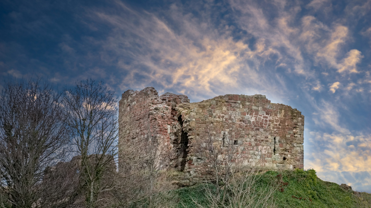 Ardrossan Castle with a cloudy blue sky in the background