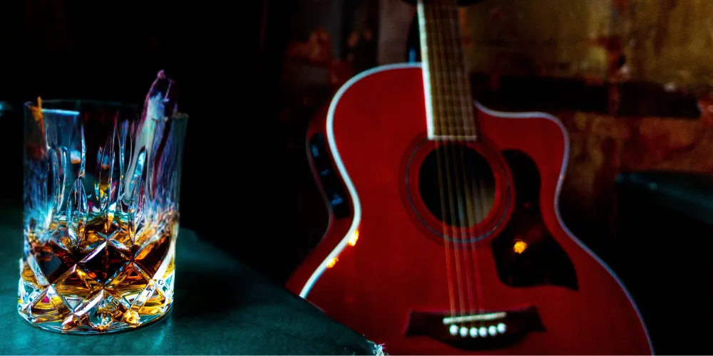 Glass of whisky and a guitar