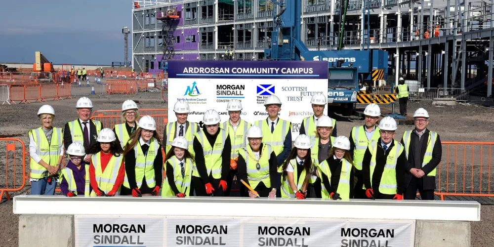 Provost Anthea Dickson signs steel with pupils, Council Leader Tony Gurney and a range of elected members and partners