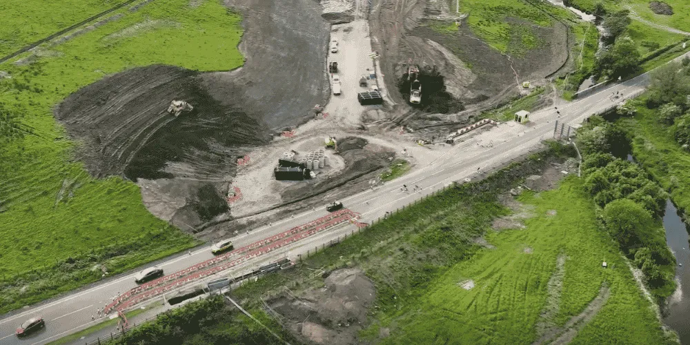 An aerial view of a road being constructed in the countryside