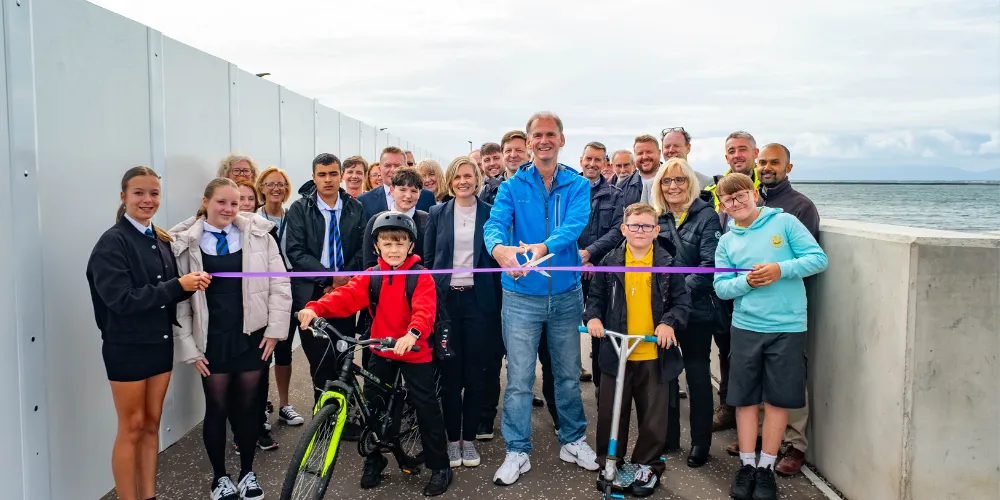Cllr Gurney cutting ribbon to open new coastal path