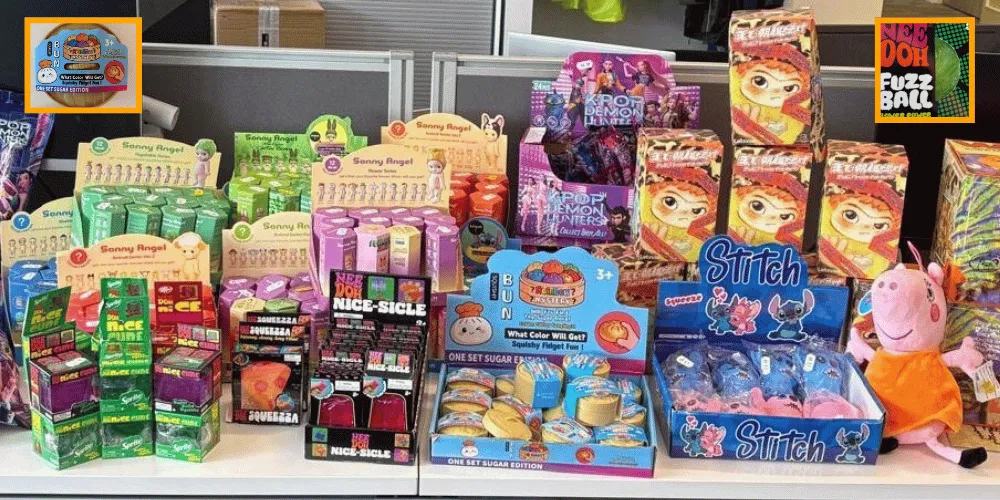 Toys, including a Peppa Pig, in boxes stacked on a desk