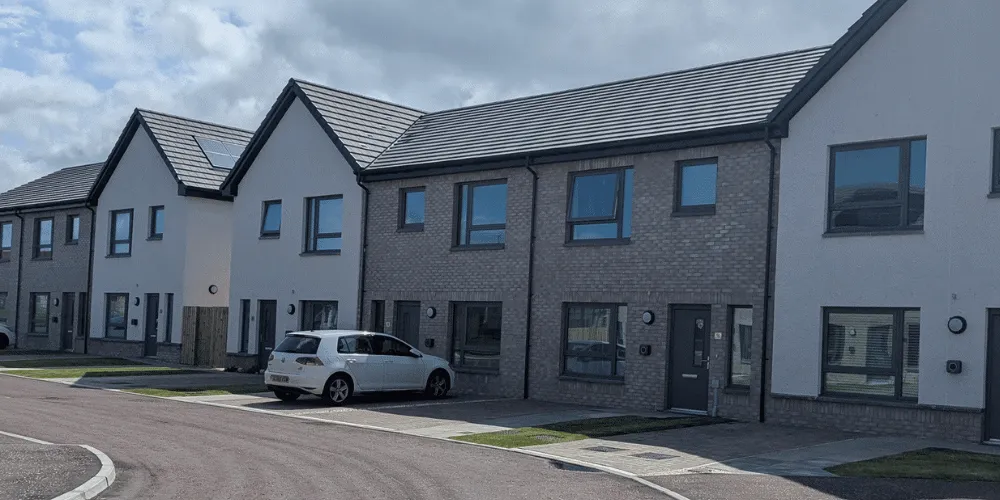 A view of a row of newly-built houses in the sunshine