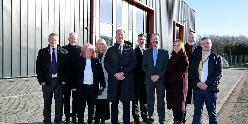 Council Leader Tony Gurney, officers and Muir Construction representatives outside new facility at i3
