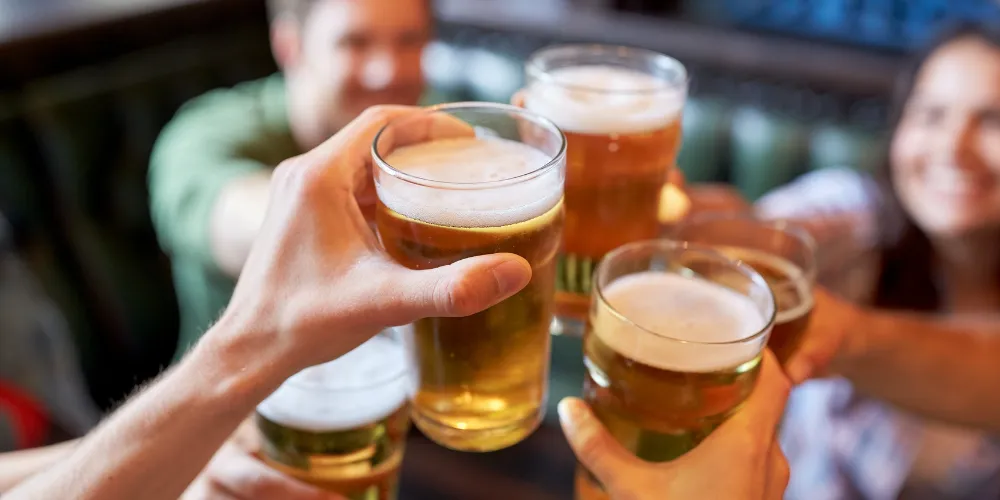 Generic picture of people holding pints of beer