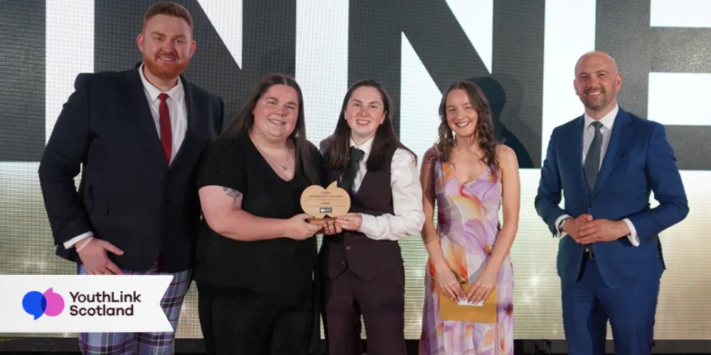 Local youth workers celebrated at national awards ceremony group photo with trophy
