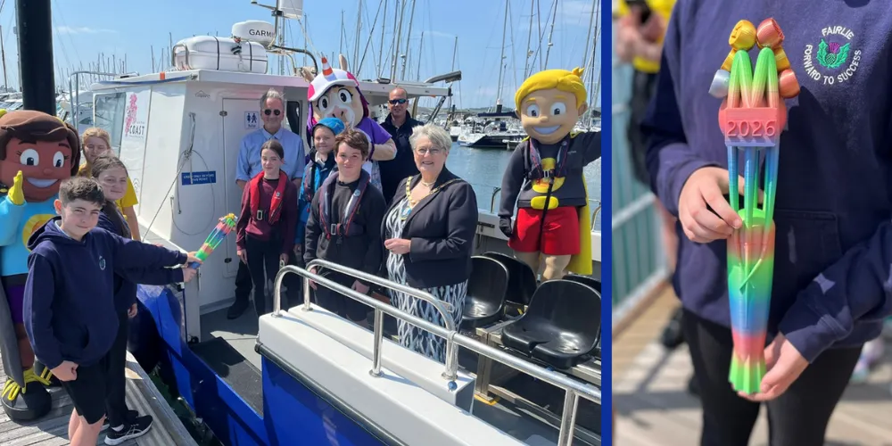 North Ayrshire’s Commonwealth Baton being passed onto boat with mascots and North Ayrshire Provost at Largs Marina