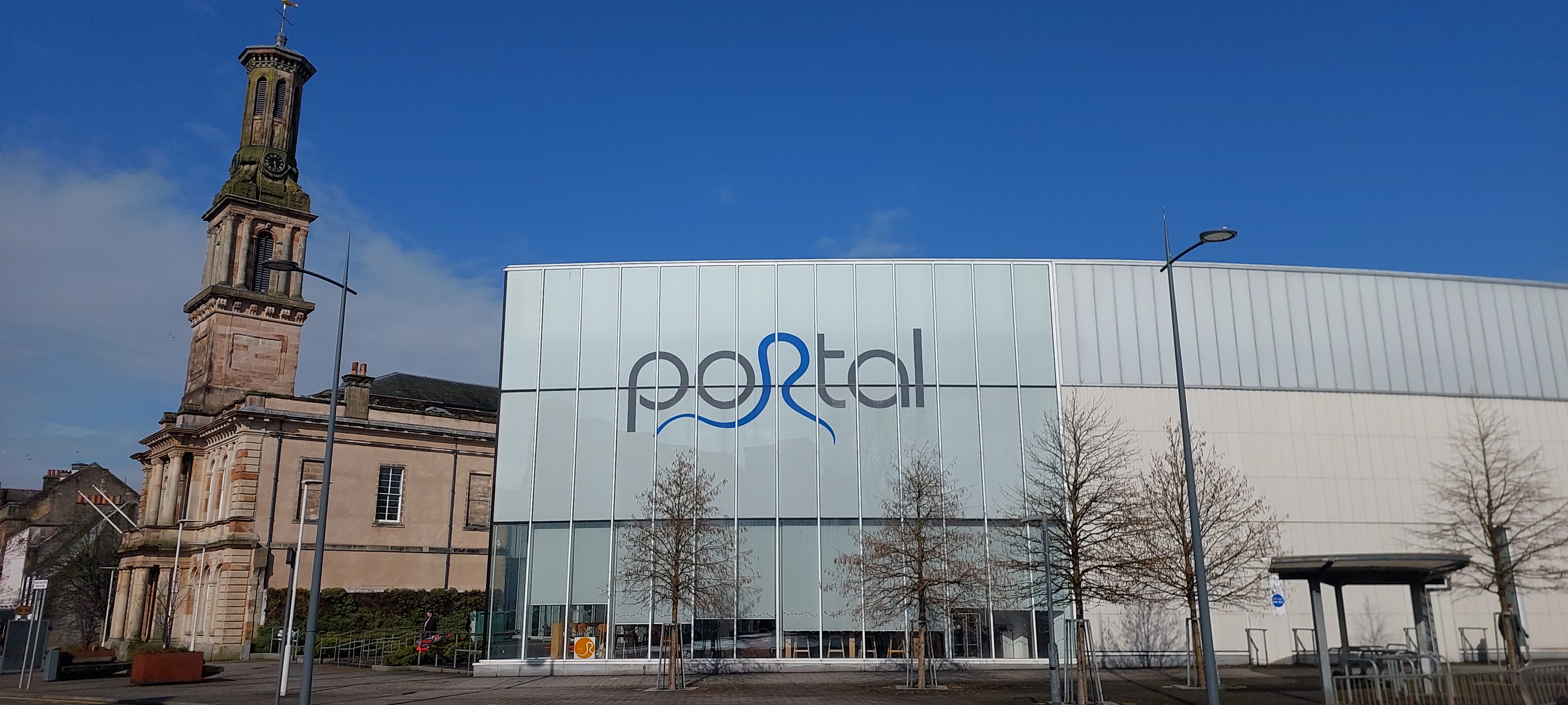 A leisure centre building on a bright day with blue sky above