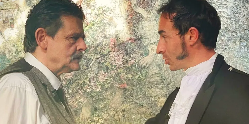 Two male performers in Robert Burns inspired show with abstract background