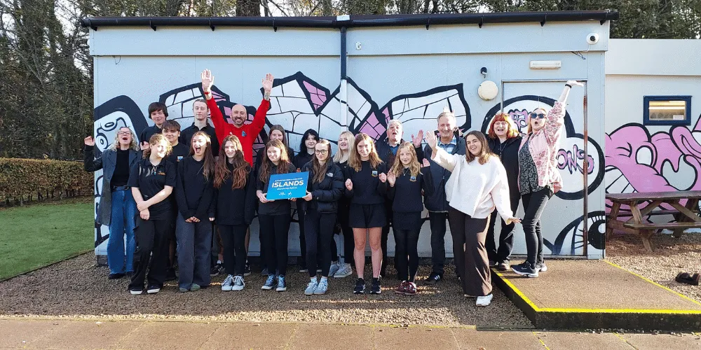 Arran High School pupils, Councillors and Arran Youth Foundations staff celebrating the funding news