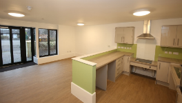Open plan interior showing kitchen and access to outdoor space